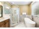 Modern bathroom with a glass shower, a luxurious bathtub, and sleek fixtures at 9 24Th Ave, Isle of Palms, SC 29451