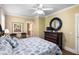 Bedroom suite with a ceiling fan, decor, and a connected bathroom that offers convenience and privacy at 9 24Th Ave, Isle of Palms, SC 29451