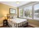 Cozy bedroom with three bright windows, stylish bedding, and a decorative picture that enhances its appeal at 9 24Th Ave, Isle of Palms, SC 29451