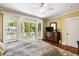 Sunny bedroom with hardwood floors and access to an outdoor porch with white railings at 9 24Th Ave, Isle of Palms, SC 29451