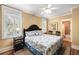 Inviting bedroom with three large windows, a dark wood bed frame, and coordinated decor for a relaxing retreat at 9 24Th Ave, Isle of Palms, SC 29451