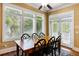 Charming dining area with natural light, a wooden table and black chairs, creating a cozy space at 9 24Th Ave, Isle of Palms, SC 29451