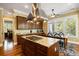 Spacious kitchen with granite counters, stainless appliances, a central island, and a dining area at 9 24Th Ave, Isle of Palms, SC 29451