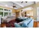 Expansive living area featuring multiple seating options and large windows, creating a welcoming and bright atmosphere at 9 24Th Ave, Isle of Palms, SC 29451