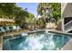 Refreshing backyard pool with ample seating, perfect for relaxing or entertaining guests in a private outdoor setting at 9 24Th Ave, Isle of Palms, SC 29451