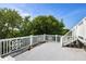 Wide rooftop deck with white railings and stairs, perfect for enjoying outdoor gatherings and panoramic scenery at 9 24Th Ave, Isle of Palms, SC 29451