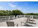 Rooftop deck with white railings and patio furniture, an idyllic spot for relaxation and enjoying the view at 9 24Th Ave, Isle of Palms, SC 29451
