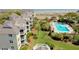 Aerial view of condos, swimming pool, and beach at 9000 Palmetto Drive # D-304, Isle of Palms, SC 29451