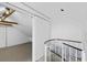 View of unfinished attic space with exposed beams, and spiral staircase at 9000 Palmetto Drive # D-304, Isle of Palms, SC 29451