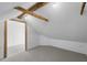 View of unfinished attic space featuring exposed beams and a door at 9000 Palmetto Drive # D-304, Isle of Palms, SC 29451