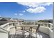 View of patio furniture on balcony with ocean views at 9000 Palmetto Drive # D-304, Isle of Palms, SC 29451