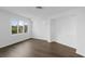 Clean and bright bedroom with wood flooring and a large window for natural light at 9000 Palmetto Drive # D-304, Isle of Palms, SC 29451