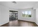 Bright bedroom with hardwood floors, lots of natural light and access to a private porch at 9000 Palmetto Drive # D-304, Isle of Palms, SC 29451
