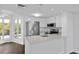 Modern kitchen features stainless steel appliances, quartz countertops, and ample cabinet space at 9000 Palmetto Drive # D-304, Isle of Palms, SC 29451