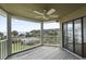 Enjoy ocean views from this screened porch, complete with a ceiling fan and ample space at 9000 Palmetto Drive # D-304, Isle of Palms, SC 29451