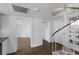 Unique spiral staircase with white railing, connecting multiple levels of the home at 9000 Palmetto Drive # D-304, Isle of Palms, SC 29451