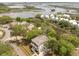 Panoramic aerial view showcasing a home's setting near waterfront and other beautiful residences at 1006 Basin Ln, Johns Island, SC 29455