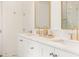 Close-up of bathroom featuring double vanity with marble countertops and elegant fixtures at 1006 Basin Ln, Johns Island, SC 29455