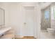View into bathroom featuring white vanity with makeup mirror and walk-in shower at 1006 Basin Ln, Johns Island, SC 29455