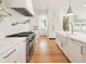 Beautiful, bright kitchen with modern stainless steel appliances, marble countertops, and a center island at 1006 Basin Ln, Johns Island, SC 29455