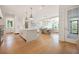 Bright, open-concept kitchen with an island, modern lighting, and a seamless transition to the dining area at 1006 Basin Ln, Johns Island, SC 29455