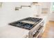 Modern kitchen featuring a stainless steel gas range and white countertops and backsplash at 1006 Basin Ln, Johns Island, SC 29455