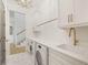 Well-lit laundry room with modern appliances and stylish tile at 1006 Basin Ln, Johns Island, SC 29455