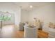 Sitting room featuring wood floors and view out window with 2 gray chairs at 1006 Basin Ln, Johns Island, SC 29455