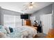 Bedroom with a wooden bed frame, tv and dresser and windows with natural light at 104 Buchanan Cir, Goose Creek, SC 29445