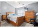 Bedroom features a wooden bed frame, ceiling fan and windows, with a tv and dressers at 104 Buchanan Cir, Goose Creek, SC 29445