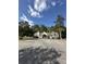 Beautiful clubhouse with ample parking, a white picket fence, and well-maintained landscaping at 104 Buchanan Cir, Goose Creek, SC 29445