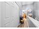 Upstairs hallway features grey walls, wood-look floors, coat closet, and furniture decor at 104 Buchanan Cir, Goose Creek, SC 29445