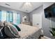 This main bedroom features a ceiling fan, tv, and a dresser with a mirror at 104 Buchanan Cir, Goose Creek, SC 29445