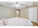 Neutral bedroom features ceiling fan, light walls, and access to ensuite bathroom at 105 Aviary Ct, Summerville, SC 29483