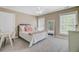 Comfortable carpeted bedroom with a ceiling fan and many windows for natural light at 105 Aviary Ct, Summerville, SC 29483