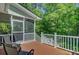 Enjoy the outdoors on this deck with railing and views of the surrounding woods at 105 Aviary Ct, Summerville, SC 29483