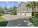 Spacious three-car garage with a large driveway, perfect for multiple vehicles and easy access at 105 Aviary Ct, Summerville, SC 29483