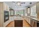Spacious eat-in kitchen featuring a large island, granite countertops, and stainless steel appliances, perfect for culinary enthusiasts at 105 Aviary Ct, Summerville, SC 29483