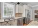 Kitchen sink with stainless steel appliances and tiled backsplash at 105 Aviary Ct, Summerville, SC 29483