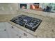 Kitchen cooktop with granite countertops and cabinetry at 105 Aviary Ct, Summerville, SC 29483