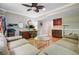 Inviting living room with a comfortable couch, desk area, and wet bar at 105 Aviary Ct, Summerville, SC 29483