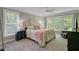 Serene main bedroom retreat with large windows and neutral tones, promoting relaxation and comfort at 105 Aviary Ct, Summerville, SC 29483