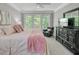 Serene main bedroom retreat with large windows and neutral tones, promoting relaxation and comfort at 105 Aviary Ct, Summerville, SC 29483