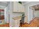 Charming office space featuring custom cabinets, granite counters, and a view into multiple rooms, blending work and home seamlessly at 105 Aviary Ct, Summerville, SC 29483