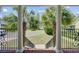 Inviting front porch view with white pillars and black railings, framing the neighborhood at 105 Aviary Ct, Summerville, SC 29483