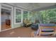 Relax on screened porch with comfortable seating and open views to the backyard at 105 Aviary Ct, Summerville, SC 29483