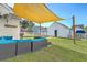 A shaded backyard patio with comfortable seating and a grill, perfect for outdoor entertaining and relaxation at 107 Amaranth Ave, Summerville, SC 29483