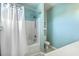 Bright bathroom featuring a shower with a white curtain, toilet, and cabinet at 107 Amaranth Ave, Summerville, SC 29483