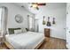 A well-lit bedroom features hardwood floors and guitars hanging on the wall at 107 Amaranth Ave, Summerville, SC 29483