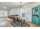 Open-concept featuring a dining room with a long table and decorative cabinet at 107 Amaranth Ave, Summerville, SC 29483